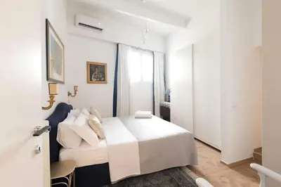 Letto o letti in una camera di CamilaCasaDeFirenze V3