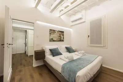 Letto o letti in una camera di Palazzotto Pitti