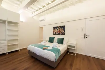 Letto o letti in una camera di Palazzotto Pitti