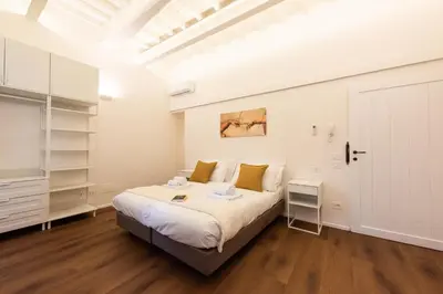 Letto o letti in una camera di Palazzotto Pitti