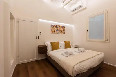 Letto o letti in una camera di Palazzotto Pitti