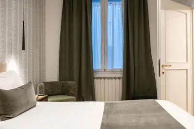 Letto o letti in una camera di Dimora della Quiete - Firenze centro Fortezza