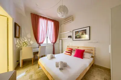 Letto o letti in una camera di CozySignoriaVenere
