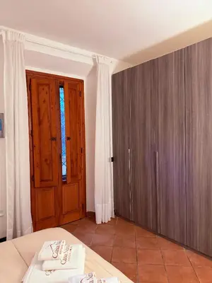 Letto o letti in una camera di casa nina boutique home FIRENZE