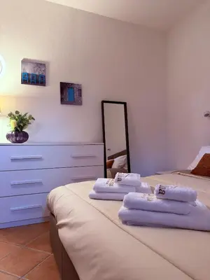 Letto o letti in una camera di casa nina boutique home FIRENZE