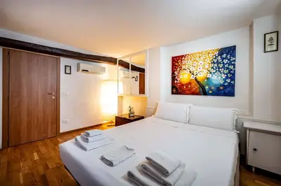 Letto o letti in una camera di Roommo Carmine