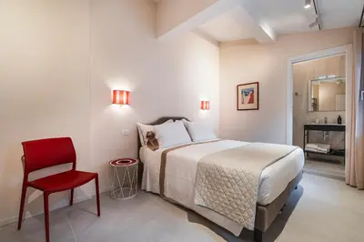Letto o letti in una camera di Palazzo Accademia