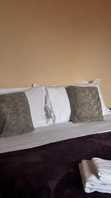 Letto o letti in una camera di The Tower View App