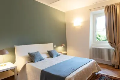 Letto o letti in una camera di Palazzo Goggi Marcovaldi Design Apartment