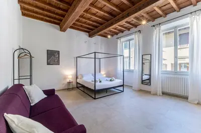 Letto o letti in una camera di UNYCA - Florence Pitti Apartment