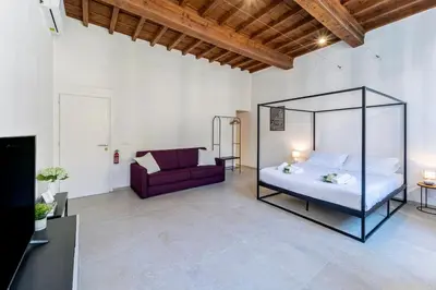 Letto o letti in una camera di UNYCA - Florence Pitti Apartment
