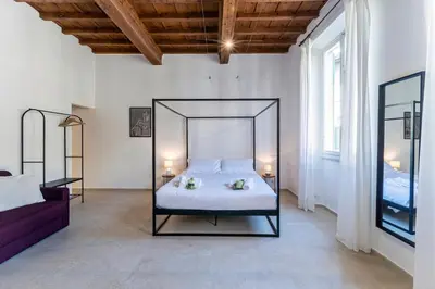 Letto o letti in una camera di UNYCA - Florence Pitti Apartment