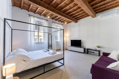 Letto o letti in una camera di UNYCA - Florence Pitti Apartment
