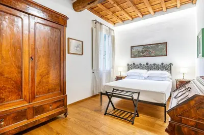 Letto o letti in una camera di Dante Alighieri Adapartment Collection