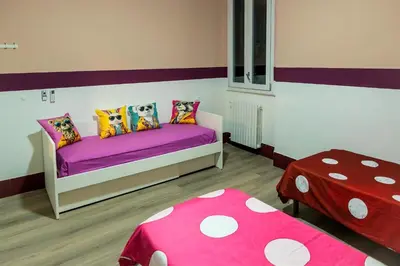 Letto o letti in una camera di Cozy and charming triple room - ColivingFlorence VdM