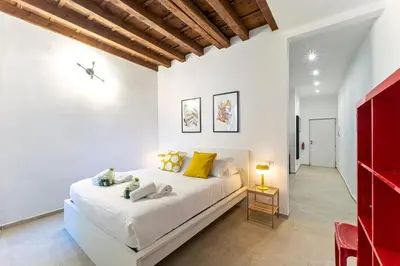 Letto o letti in una camera di UNYCA - Florence Pitti Studio