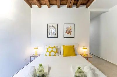Letto o letti in una camera di UNYCA - Florence Pitti Studio