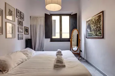 Letto o letti in una camera di Casine Apartment by Mamo Florence