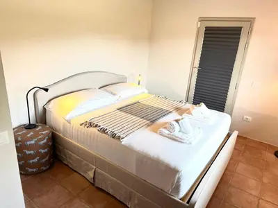 Letto o letti in una camera di Casa Zacch - Country house with terrace in the hills near Florence