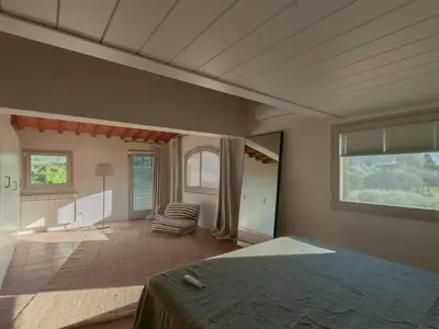 Letto o letti in una camera di Casa Zacch - Country house with terrace in the hills near Florence
