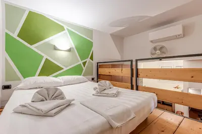 Letto o letti in una camera di GardenHouseFirenze Familiare a 10 min dal centro,possibilità parcheggio-Careggi