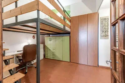 Letto o letti a castello in una camera di GardenHouseFirenze Familiare a 10 min dal centro,possibilità parcheggio-Careggi