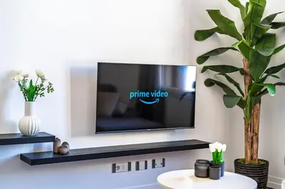 TV o dispositivi per l'intrattenimento presso Noè Luxe Home with Parking on Request