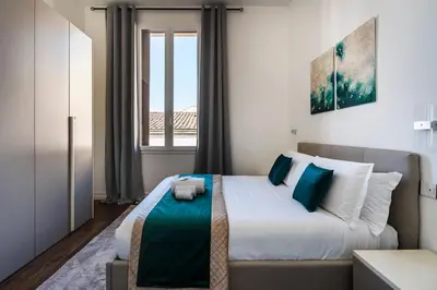 Letto o letti in una camera di Noè Luxe Home with Parking on Request
