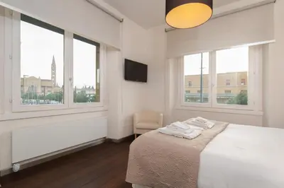 Letto o letti in una camera di Santa Maria Novella Terraced Apartment