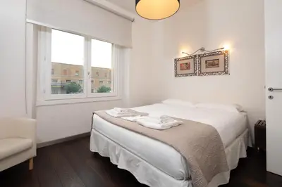 Letto o letti in una camera di Santa Maria Novella Terraced Apartment