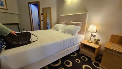 Letto o letti in una camera di Select Executive Residence