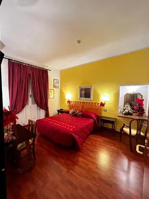 Letto o letti in una camera di Hotel S.Giorgio & Olimpic