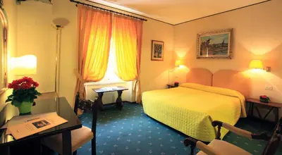 Letto o letti in una camera di Hotel S.Giorgio & Olimpic