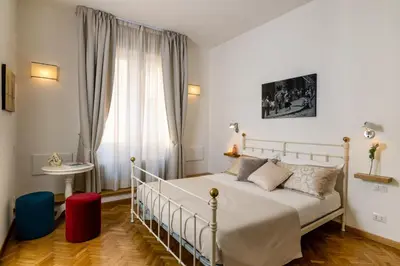 Letto o letti in una camera di MyFlorenceHoliday Gold Bridge