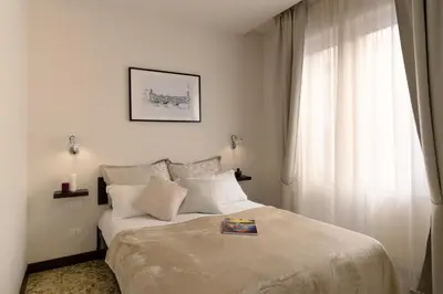 Letto o letti in una camera di MyFlorenceHoliday Gold Bridge