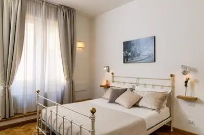 Letto o letti in una camera di MyFlorenceHoliday Gold Bridge