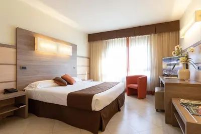 Letto o letti in una camera di NilHotel Florence