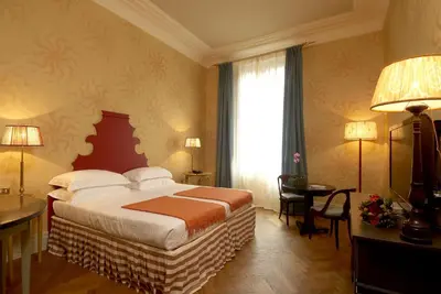 Letto o letti in una camera di Antica Torre Tornabuoni