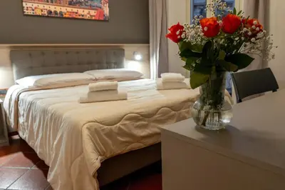 Letto o letti in una camera di La Rosa Di Firenze B&B