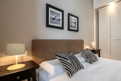 Letto o letti in una camera di Apartments Florence Borgo dei Greci