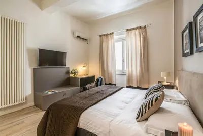 Letto o letti in una camera di Apartments Florence Borgo dei Greci