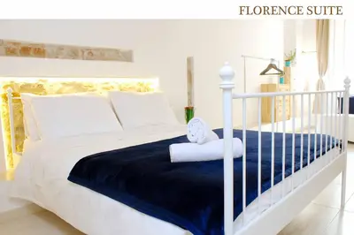 Letto o letti in una camera di Florence Suite