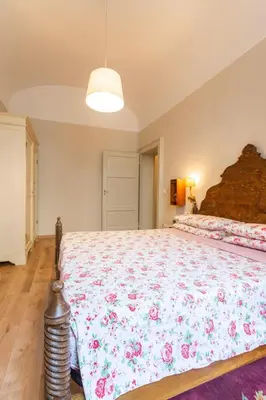 Letto o letti in una camera di Apartment Vespucci- quite Historic Palace