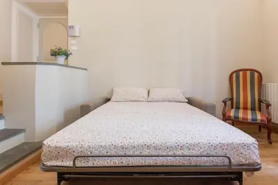 Letto o letti in una camera di Apartment Vespucci- quite Historic Palace
