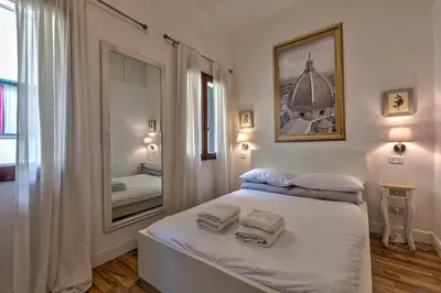 Letto o letti in una camera di Santo Spirito Suite