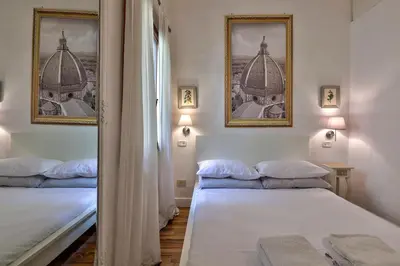 Letto o letti in una camera di Santo Spirito Suite