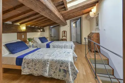 Letto o letti in una camera di Palazzo Uguccioni Apartments