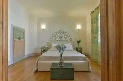 Letto o letti in una camera di Palazzo Uguccioni Apartments