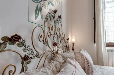 Letto o letti in una camera di B&B Le Torri Di Firenze