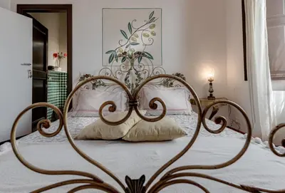 Letto o letti in una camera di B&B Le Torri Di Firenze